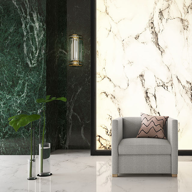 One silver high-arm chair with marble walls.